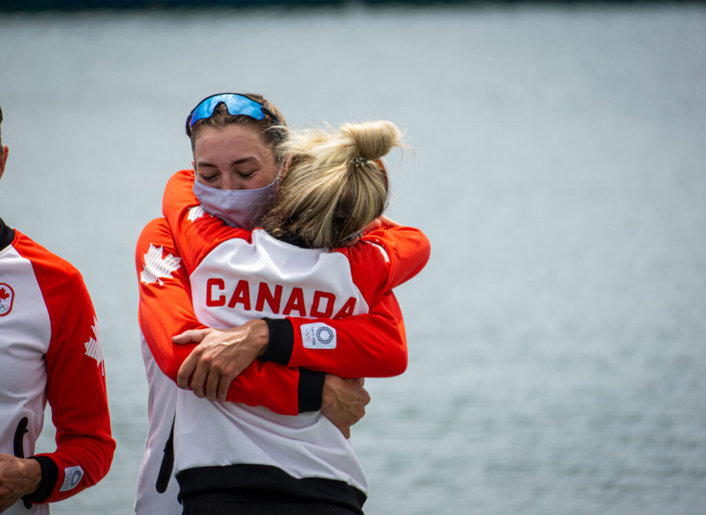 Avalon Wasteneys and Kristen Kit hug on the podium at the 2020 Tokyo Olympic Games